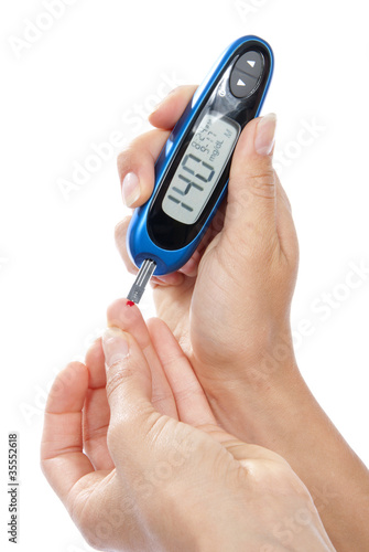 Photo: Diabetes patient measuring glucose level blood test Diabetes patient measuring glucose level blood test
