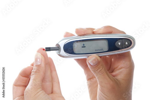 Photo: Diabetic patient measuring glucose level blood test Diabetic patient measuring glucose level blood test