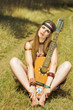 hippie sitting with a guitar