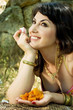Woman with dried apricots and turkish delight Woman with dried apricots and turkish delight