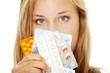Foto: Young beautiful woman with pills. Young beautiful woman with pills.