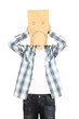 Photo: young man in sad ecological paper bag on head young man in sad ecological paper bag on head