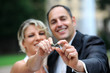 bridal couple is showing the rings