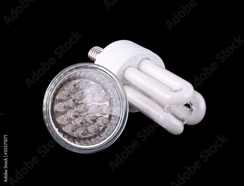 Photo: Two energy efficient bulbs on black background Two energy efficient bulbs on black background