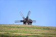 Alone windmill in a field.