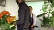Sales manager at counterand client shopping in flowers shop