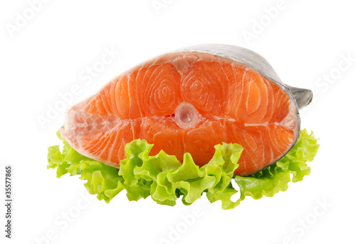 Foto: Salmon steak with greens isolated on white Salmon steak with greens isolated on white