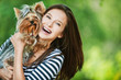 Photo: woman beautiful young holds small dog woman beautiful young holds small dog