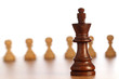 Chess king and pawns in the background