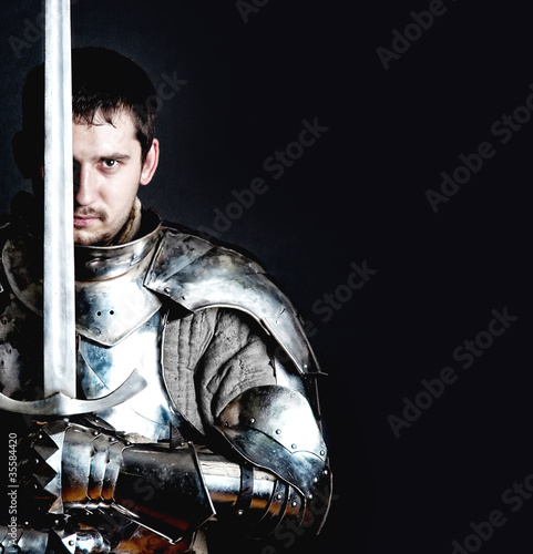Foto: Warrior holding his great sword Warrior holding his great sword