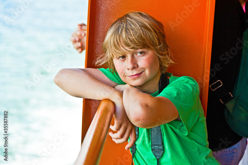 Photo: happy boy relaxing on a reeling at the ferry Staten island happy boy relaxing on a reeling at the ferry Staten island