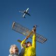 Children playing with a model glider