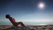 Woman sitting on deckchair and tans