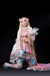 Attractive girl posing in fairy-tale doll costume Attractive girl posing in fairy-tale doll costume