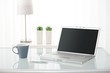 Computer, coffee mug, lamp and plants