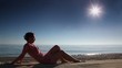 Woman sitting on beach sand