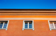 Traditional Italian orange house against the blue sky