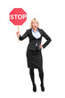 Young businesswoman holding a traffic sign stop