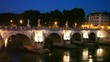 People walk along Sant Angelo Bridge at night People walk along Sant Angelo Bridge at night