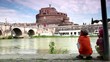 Two children sitting and look at Sant Angelo Bridge Two children sitting and look at Sant Angelo Bridge