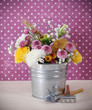 Bouquet of autumn flowers in the iron pot Bouquet of autumn flowers in the iron pot