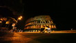 People go through pedestrian crossing near Colosseum