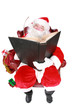 Photo: Santa writing in the book of names of good children Santa writing in the book of names of good children