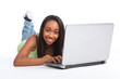 Photo: Cute African teenager girl using laptop Cute African teenager girl using laptop