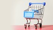 Little metallic shopping cart turning around on platform