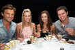 Foto: Two young couples in restaurant Two young couples in restaurant