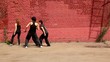 Dance team of girls start dance synchronously, then fall down