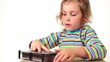 Girl make imprint of two fingers up on pin board of imprint toy