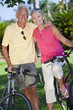 Happy Senior Couple on Bicycles In A Park