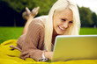 Woman with laptop laughing