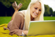 Cute girl with laptop in park