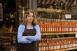 store owner in front of shop