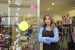 store owner in front of gift shop