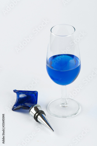 Photo: A glass filled with blue substance and an ornament #2 A glass filled with blue substance and an ornament #2