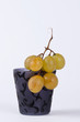 A bunch of grapes in a small cup #1