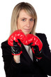 Challenging business woman with boxing gloves Challenging business woman with boxing gloves