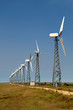 The wind generators against the blue sky
