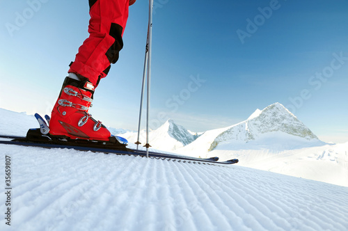 Foto: skier on an untouched ski track skier on an untouched ski track