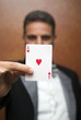 Magician performing with card