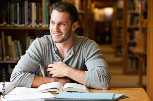 Photo: Smiling male student working Smiling male student working