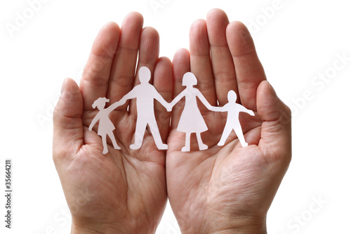Photo: Paper chain family protected in cupped hands Paper chain family protected in cupped hands