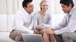 Portrait of loving couple meeting mature financial advisor
