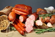 Still Life with salami, sausages, baguette and rosemary.