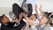 Young male executive enjoying success with team mates