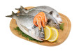 Dorado fish and shrimp on cutting board isolated