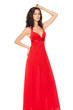 Beautiful female fashion model posing in long red dress